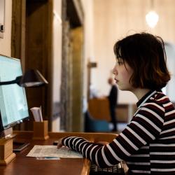 A woman studying in a library